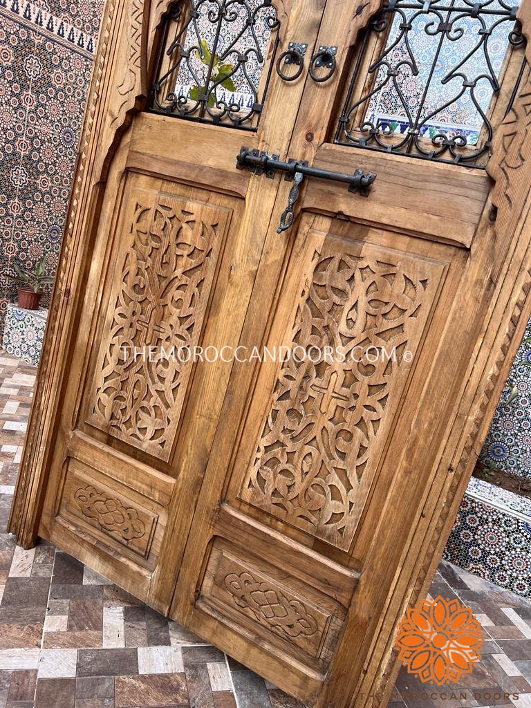 Meticulously carved Moroccan-inspired wooden entrance