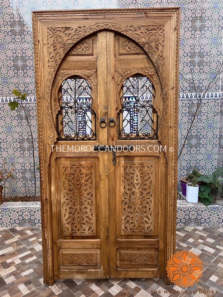 Distinctive hand-carved door with Moroccan design influence