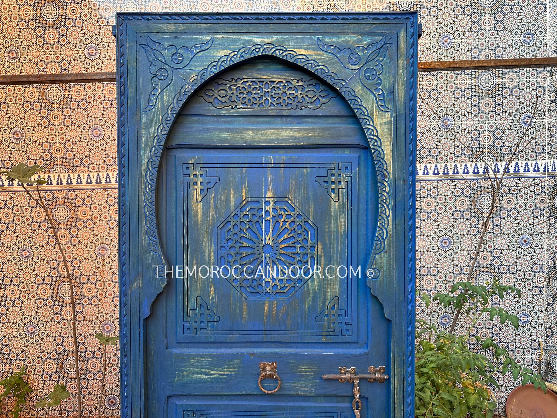 With This Custom Carved Moroccan Blue Door, you can bring the magic of Morocco into your home.