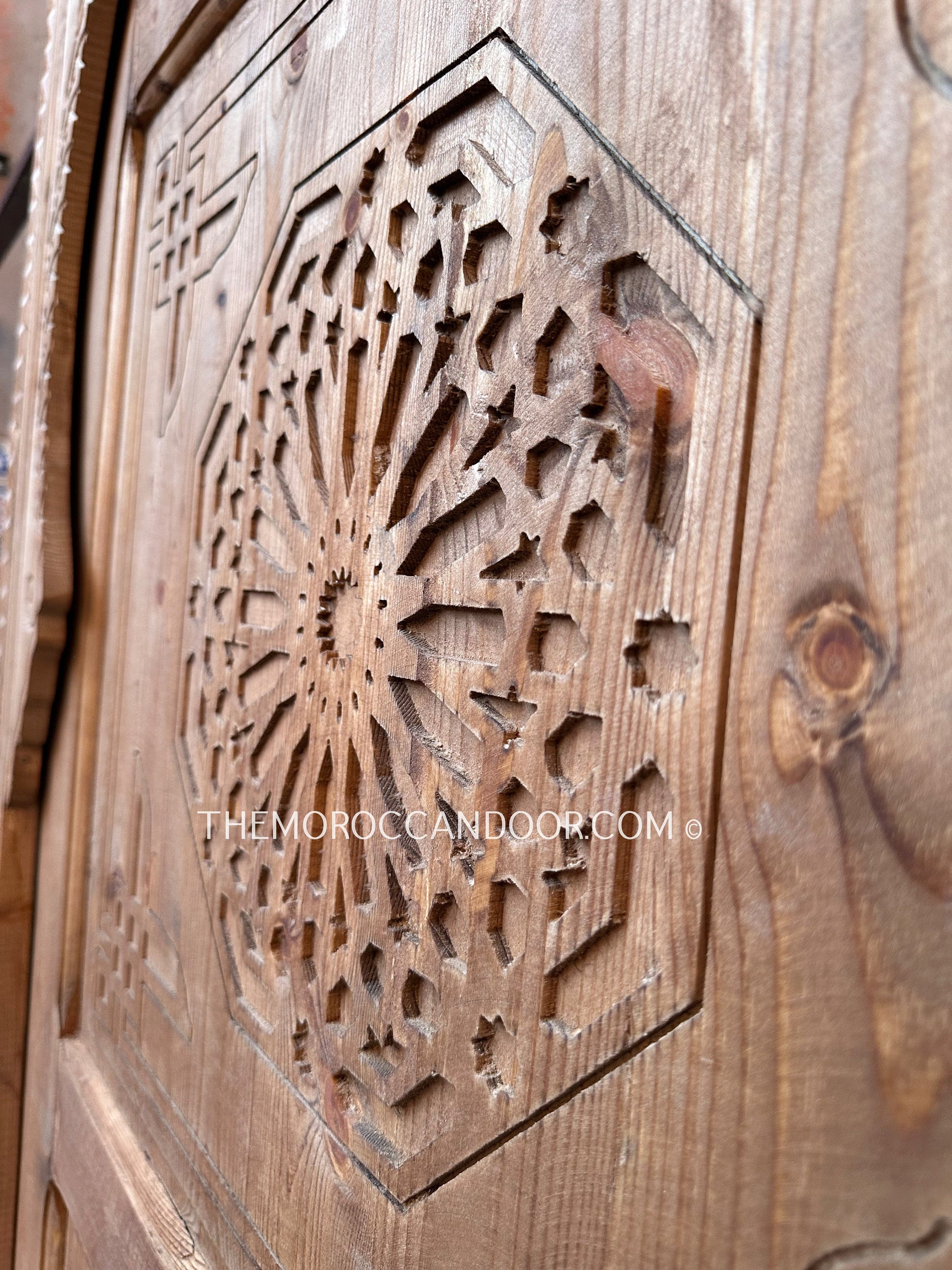 Elegant Moroccan door with detailed geometric carvings
