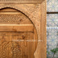 Solid wood Moroccan door adorned with intricate designs