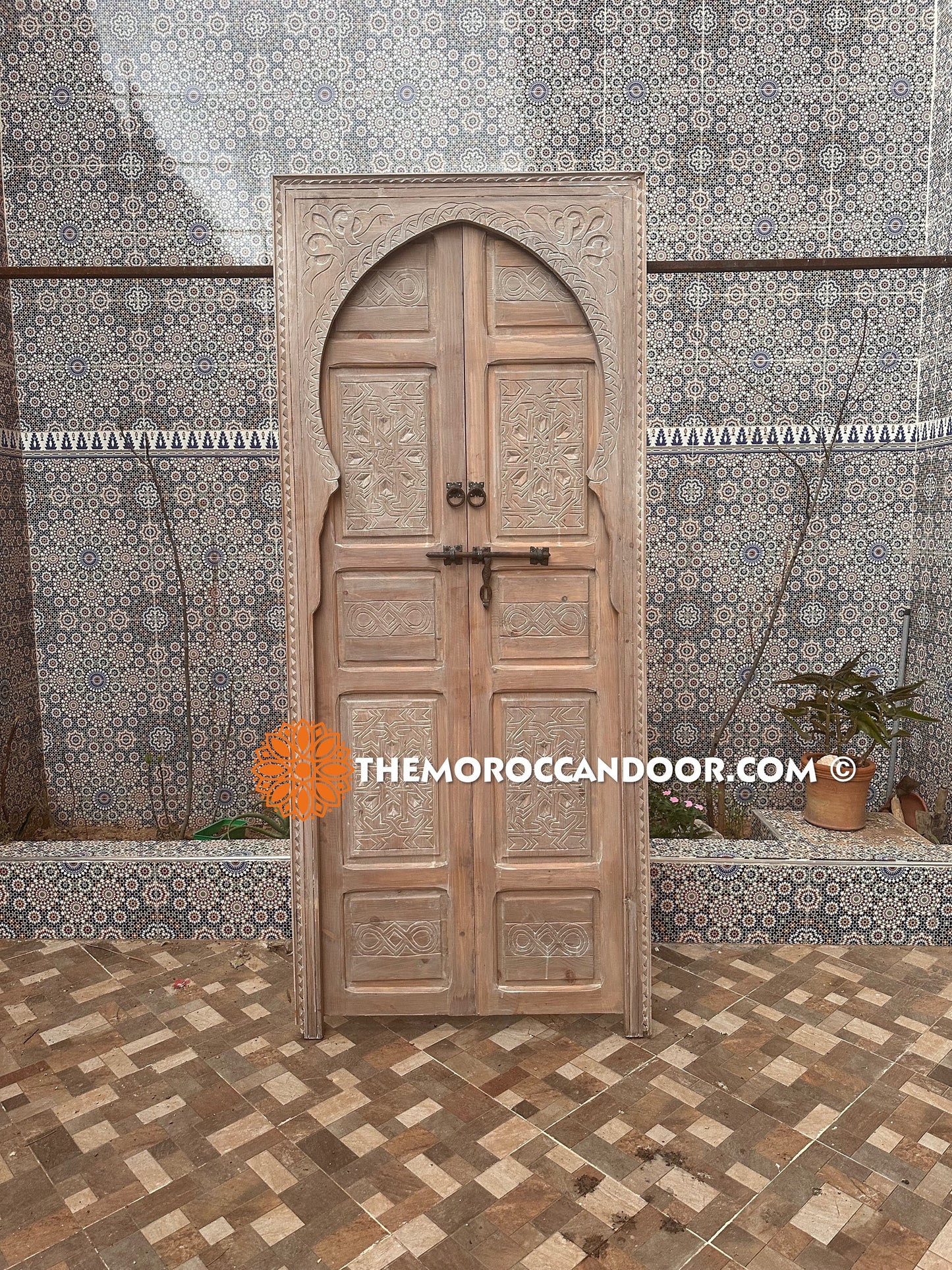 This hand-carved white door brings the peace and magic of Morocco into your home.