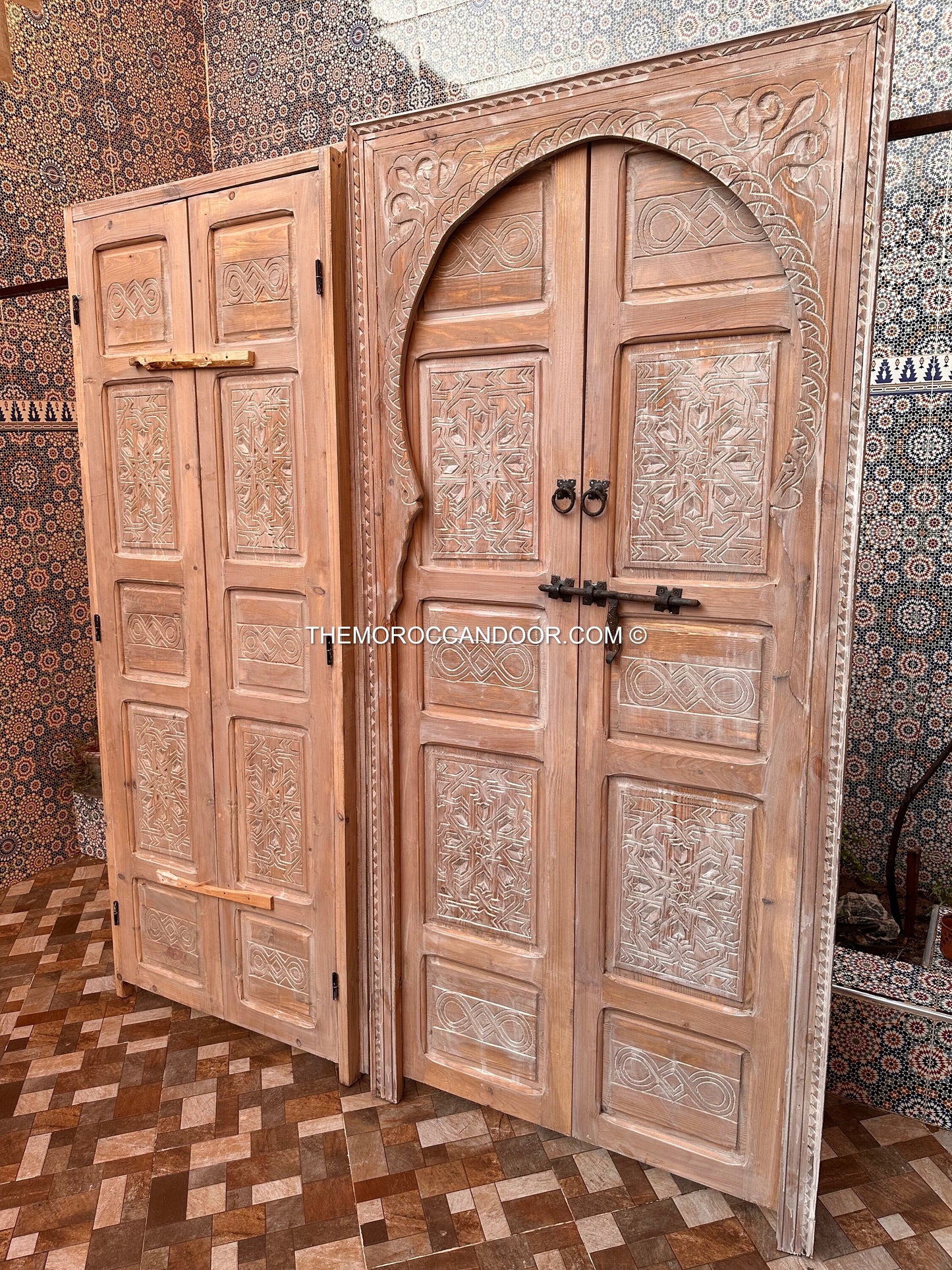 The tranquility and enchantment of Morocco enters your home through this exquisitely carved white door.