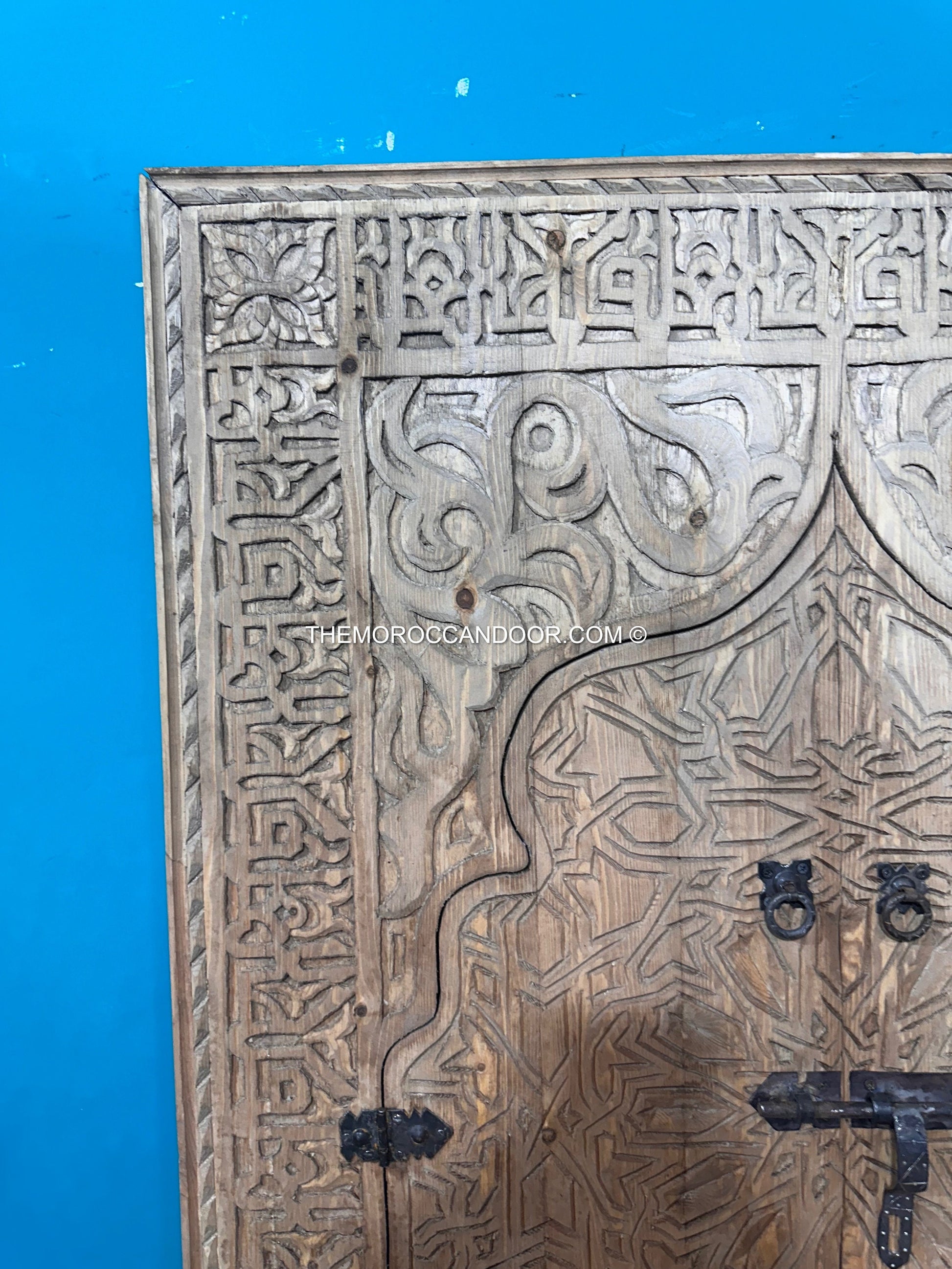 Hand-carved wooden Moroccan vintage window with a brass lock and handle, ready to ship in a beautiful brown wood frame for your wall.