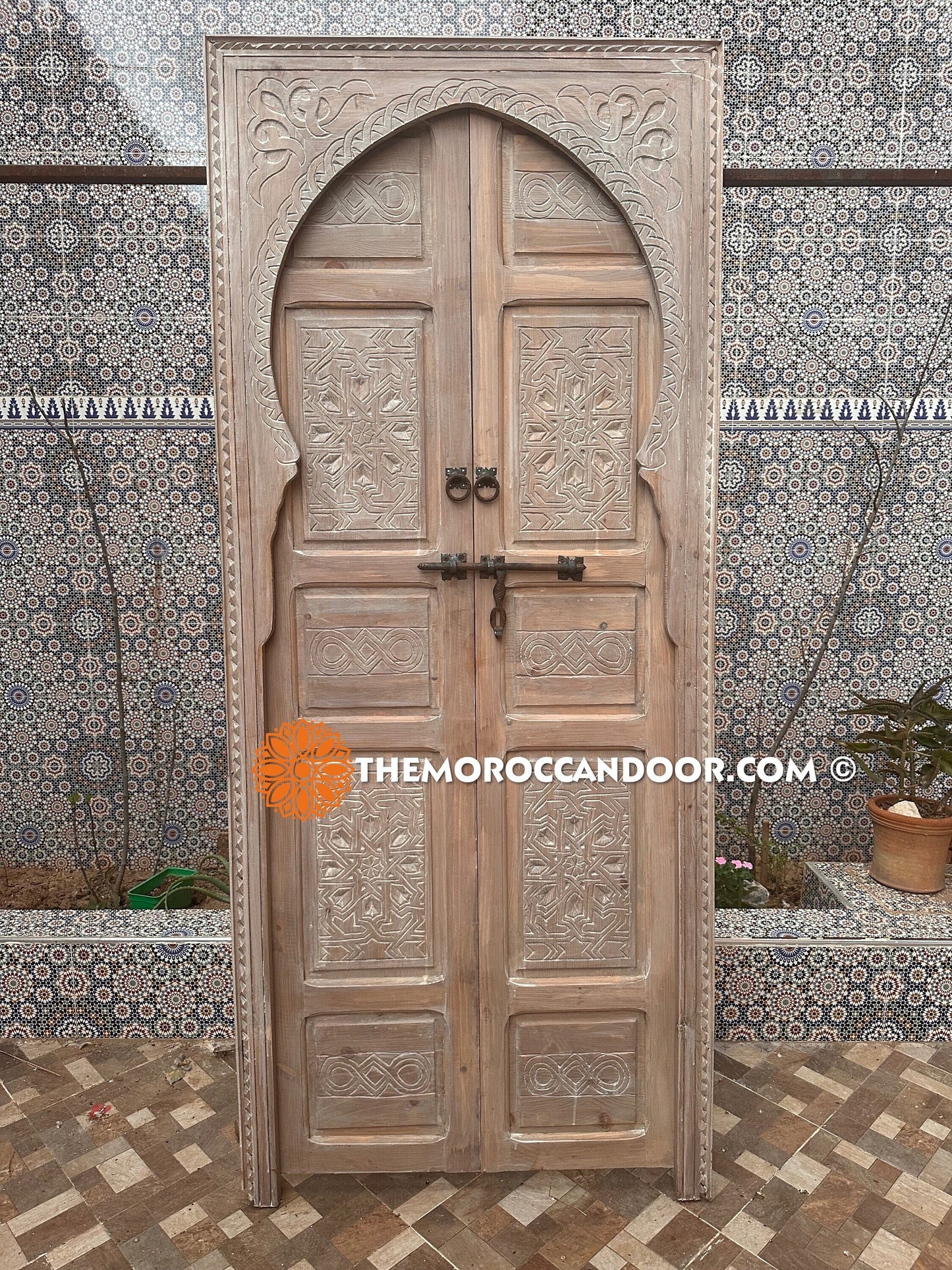 This hand-carved white door brings the peace and magic of Morocco into your home.